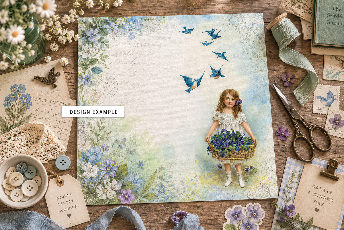 Scrapbook paper design example using a restored vintage digital illustration of a girl with a basket of violets and bluebirds, surrounded by vintage-inspired scrapbooking supplies and floral ephemera.